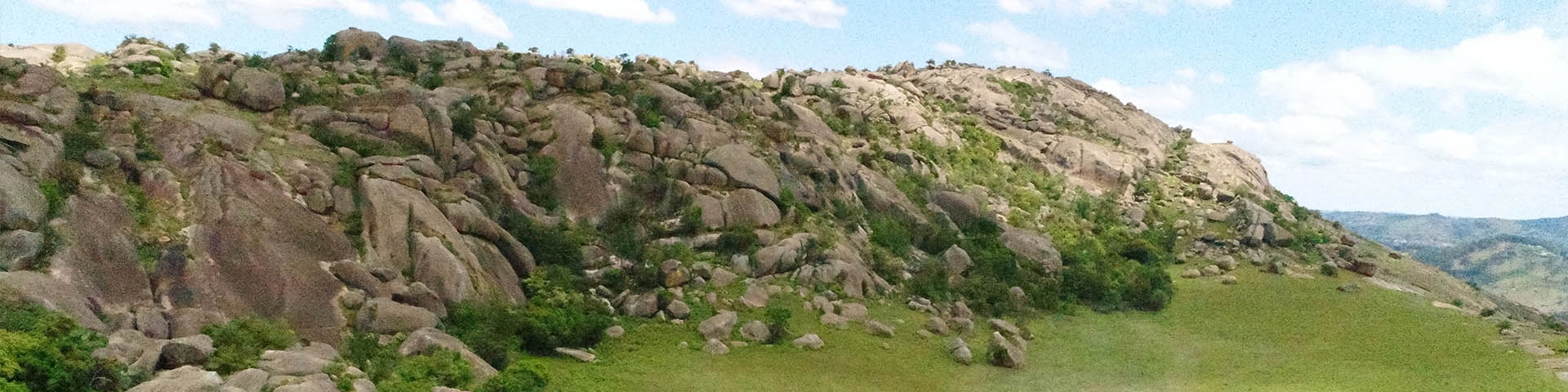 Summit of Sibebe Pluton: Rockface and grassland