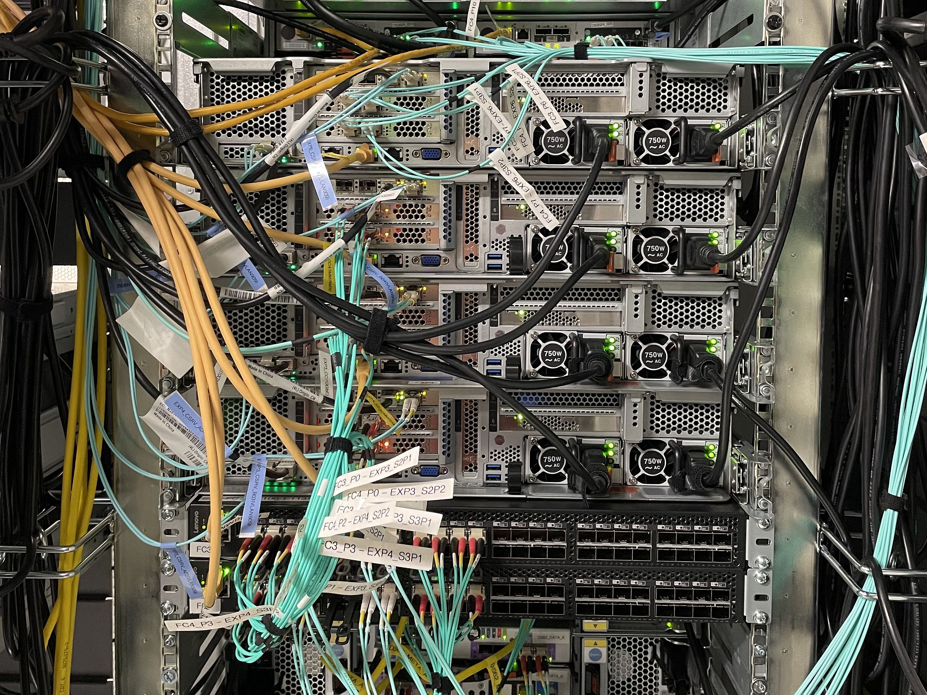 Various colorful cables lead into outlets