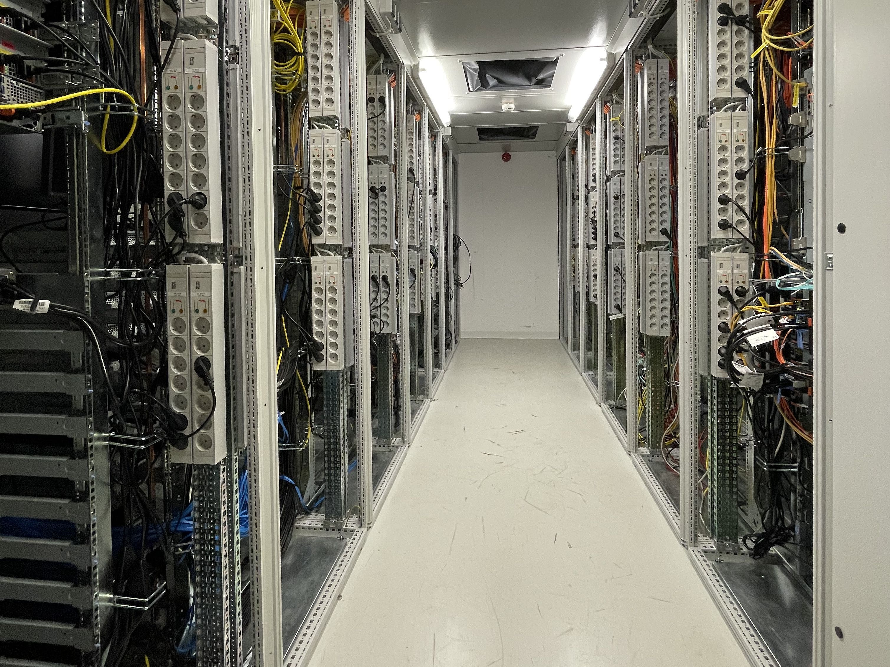 A long room is full of cables and sockets